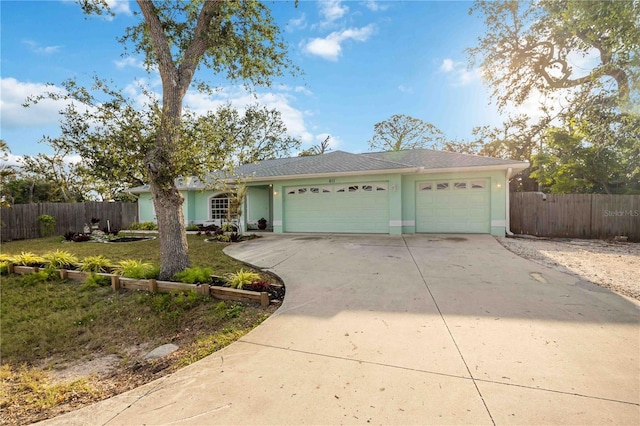 ranch-style house with a garage and a front lawn