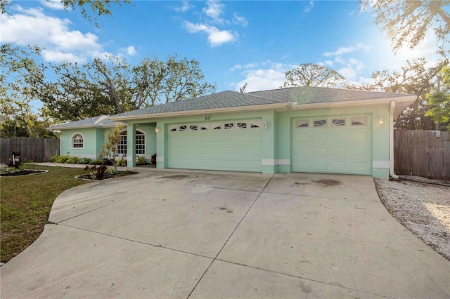 ranch-style house featuring a garage