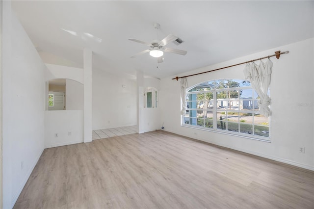 spare room featuring ceiling fan and light hardwood / wood-style flooring