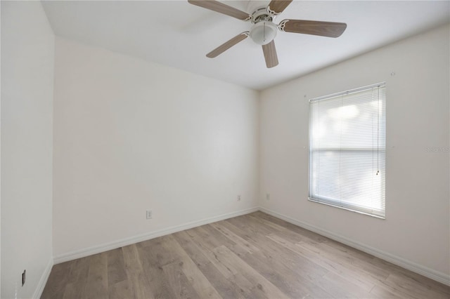 empty room featuring ceiling fan and light wood-type flooring