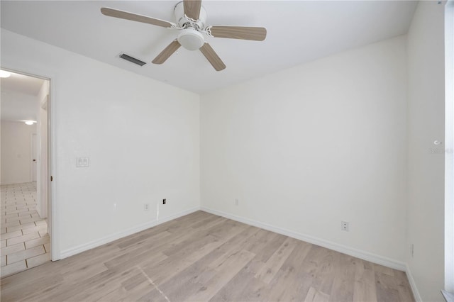 unfurnished room with ceiling fan and light wood-type flooring