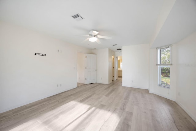 empty room featuring ceiling fan and light hardwood / wood-style floors