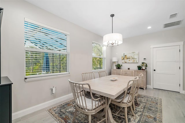 dining space featuring light wood-type flooring