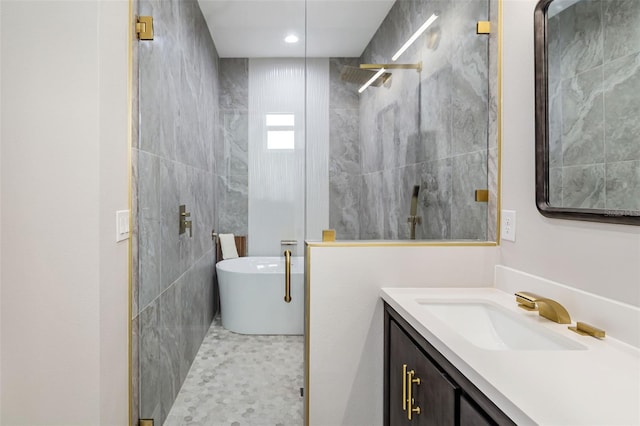 bathroom featuring separate shower and tub and vanity