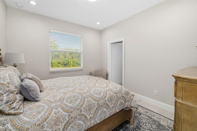 bedroom with hardwood / wood-style flooring