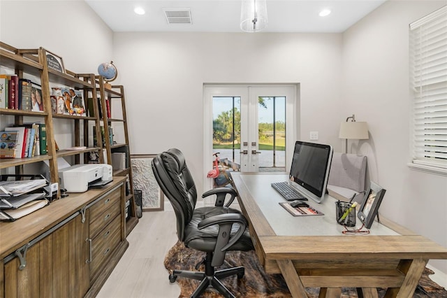 office area featuring french doors and light wood-type flooring