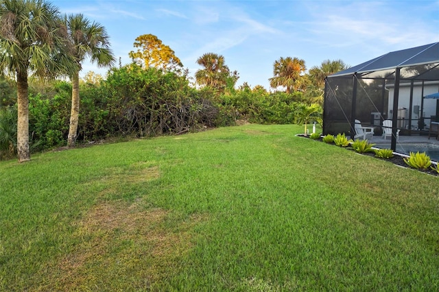 view of yard featuring a lanai