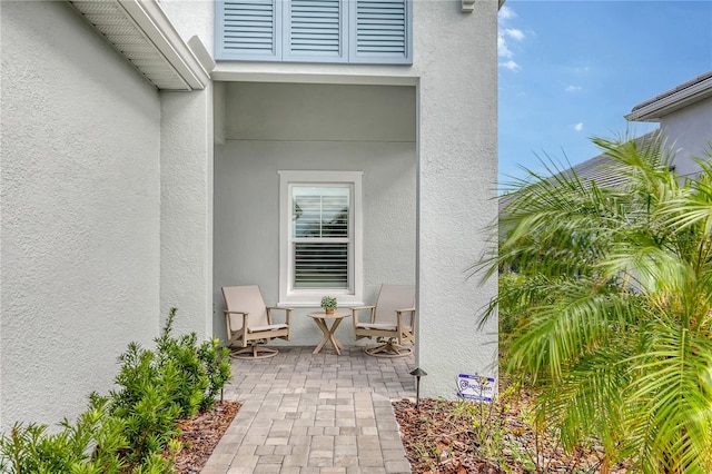 entrance to property with a patio area