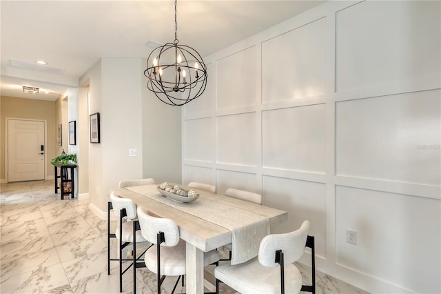 dining area featuring an inviting chandelier