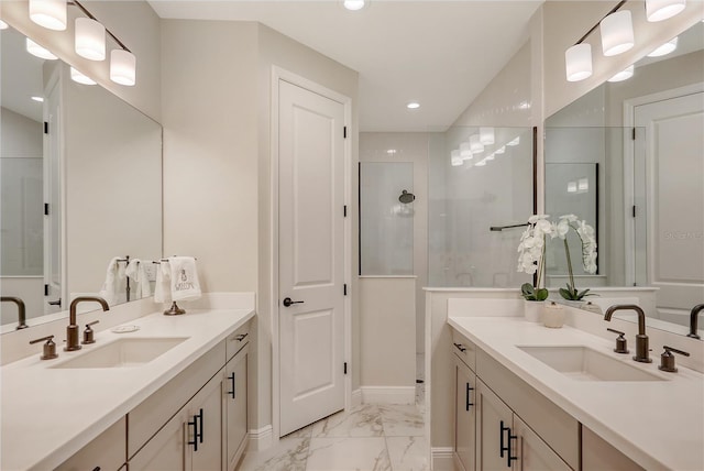 bathroom featuring a tile shower and vanity