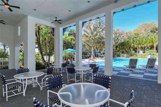 view of patio / terrace featuring ceiling fan and a community pool