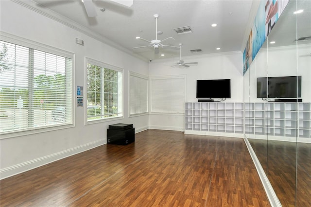 unfurnished living room with ceiling fan, ornamental molding, and dark wood-type flooring