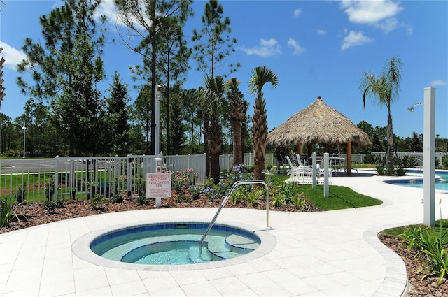 view of pool featuring a gazebo, a patio area, and a community hot tub