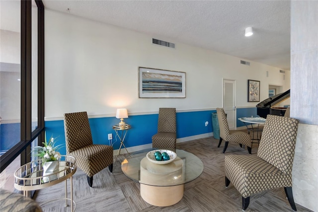 sitting room with a textured ceiling