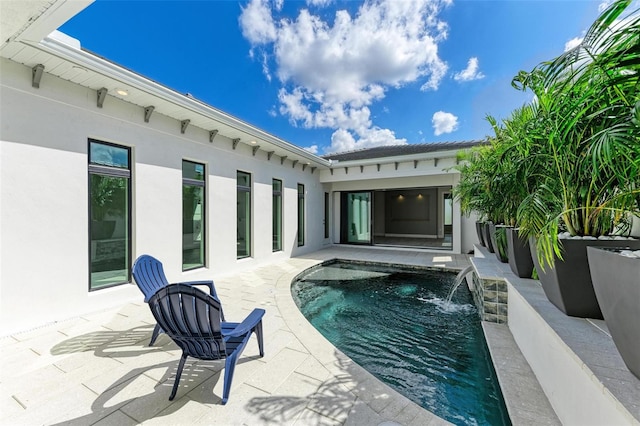 view of swimming pool with pool water feature