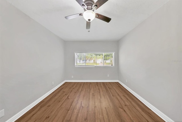 unfurnished room featuring ceiling fan and wood-type flooring