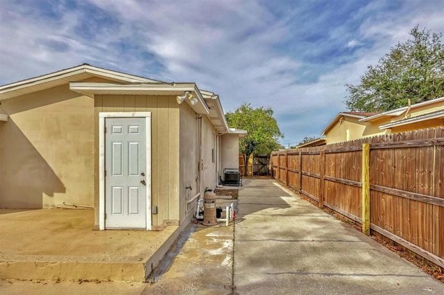 view of property exterior with a patio