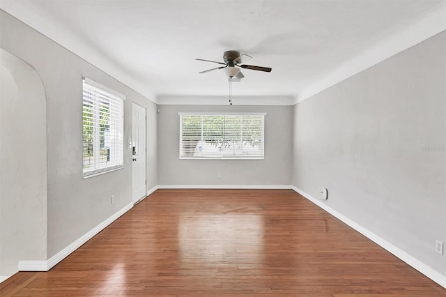 spare room featuring ceiling fan and wood-type flooring