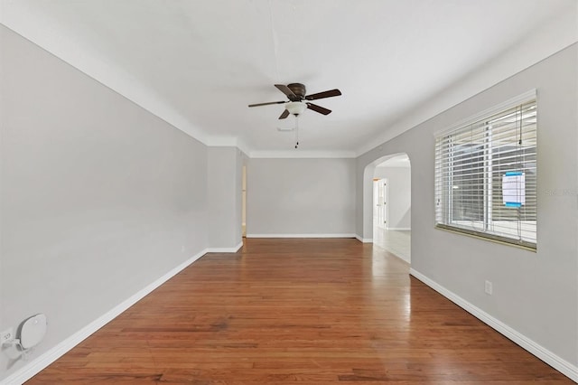 empty room featuring ceiling fan and wood-type flooring