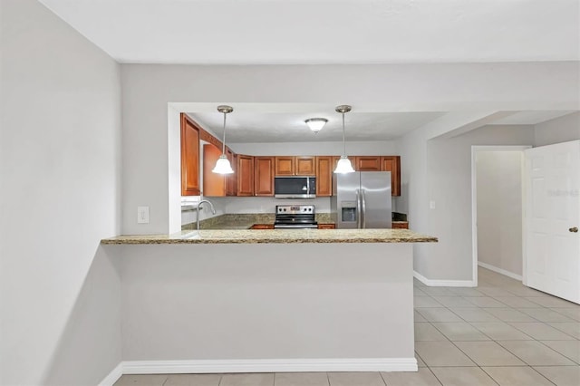 kitchen with kitchen peninsula, hanging light fixtures, light tile patterned floors, and stainless steel appliances