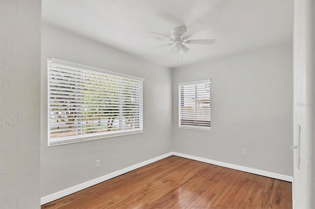 unfurnished room featuring hardwood / wood-style flooring and ceiling fan