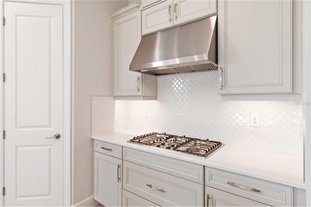 kitchen with tasteful backsplash and stainless steel gas cooktop