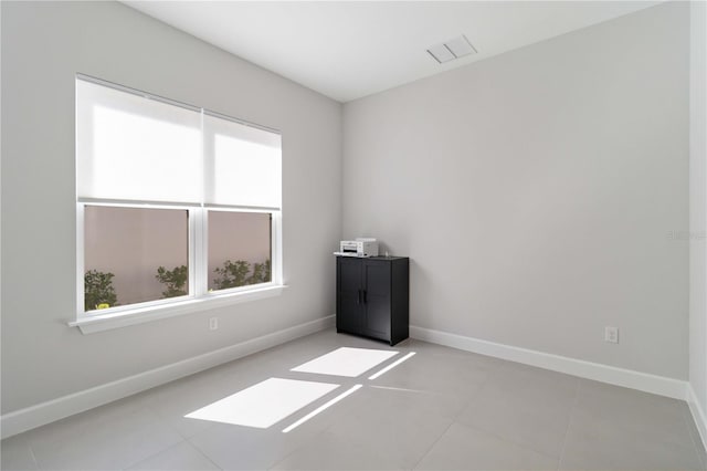 view of tiled spare room