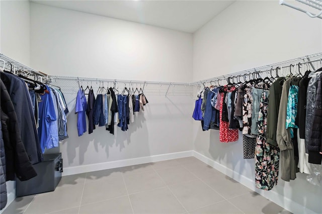 spacious closet with tile patterned floors