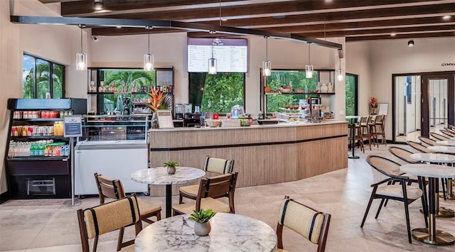 kitchen with beam ceiling and pendant lighting