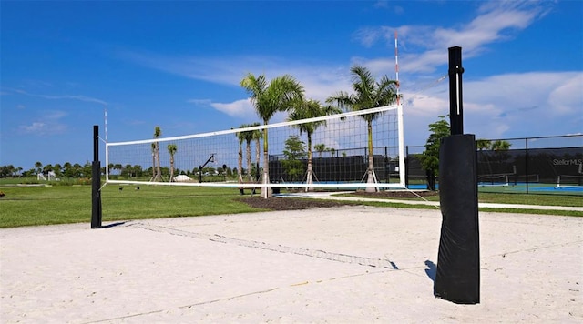 view of property's community featuring volleyball court and a lawn