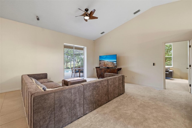 living room with ceiling fan, light carpet, and high vaulted ceiling