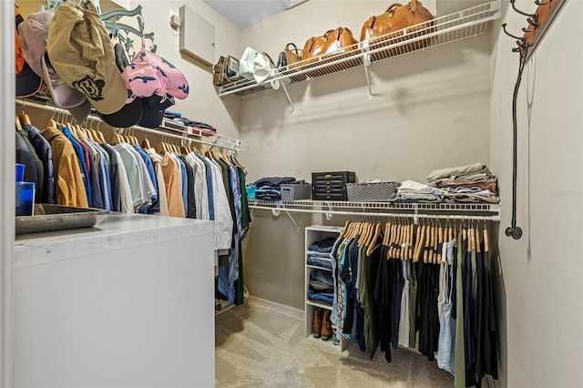 walk in closet featuring carpet