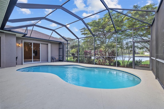 view of pool with a water view, a lanai, and a patio area