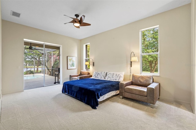 bedroom with access to exterior, light carpet, and ceiling fan