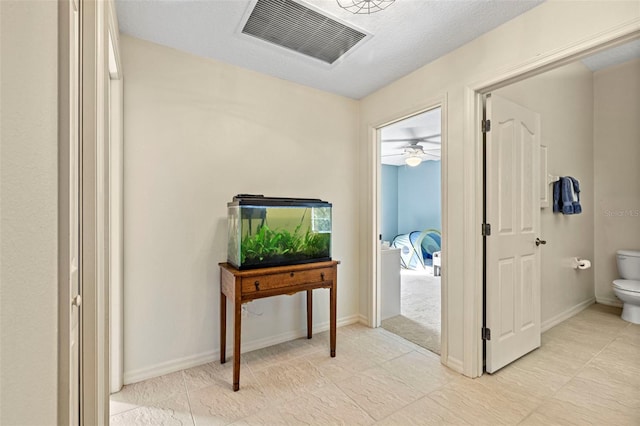 corridor with a textured ceiling