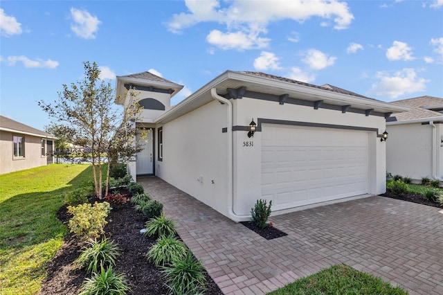 exterior space with a yard and a garage