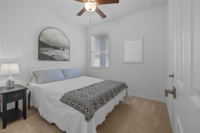 bedroom with light colored carpet and ceiling fan