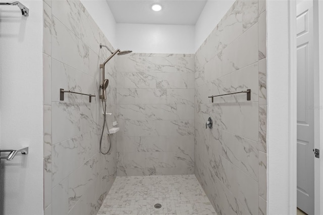 bathroom featuring a tile shower