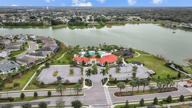 birds eye view of property with a water view