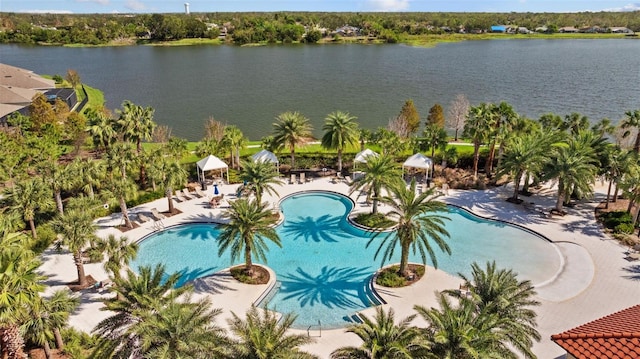 birds eye view of property with a water view