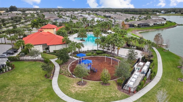 birds eye view of property with a water view