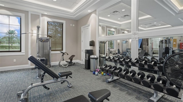 exercise room featuring carpet flooring and ornamental molding