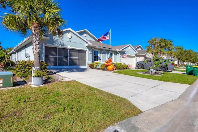 ranch-style house featuring a front yard and a garage