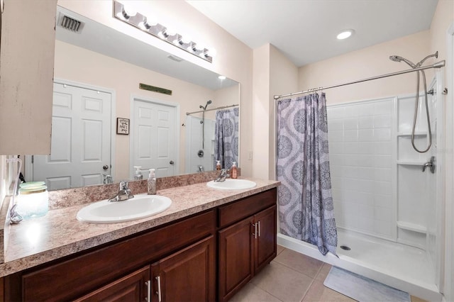 bathroom featuring tile patterned floors, a shower with curtain, and vanity