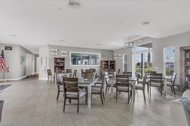 dining area with light tile patterned flooring