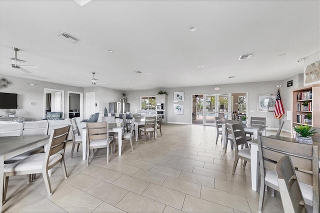 dining room with ceiling fan, french doors, and light tile patterned flooring