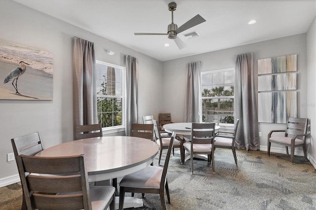 dining room with ceiling fan and a healthy amount of sunlight