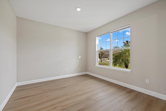 unfurnished room with light hardwood / wood-style flooring