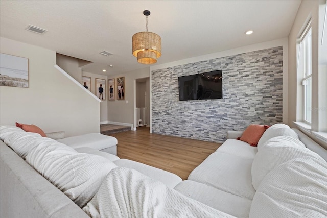 living room with plenty of natural light and wood-type flooring