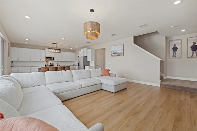 living room with light hardwood / wood-style floors